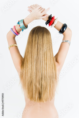 Young girl in watches and bracelets