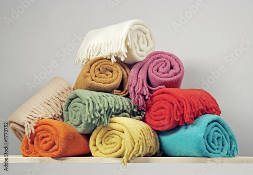Heap of rolled up blankets photo
