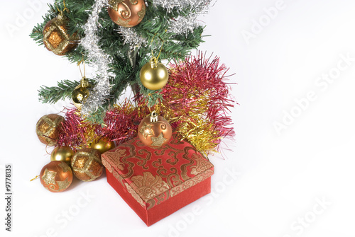 Present box under the Christmas tree isolated