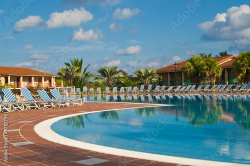 Resort swimming pool under a clear tropical sky. © William Berry