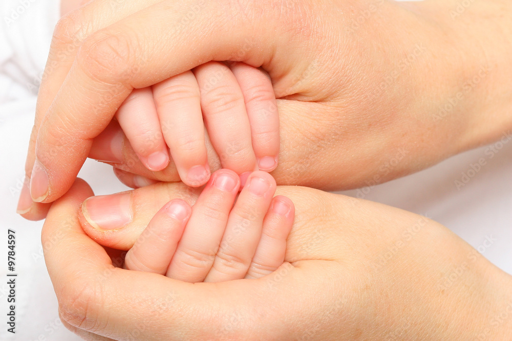 mother hand holding a new born baby hand mother hand holding a new born baby hand