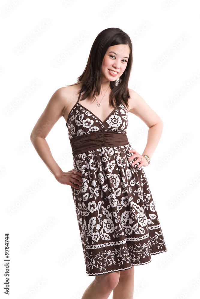 An isolated shot of a beautiful asian woman in flowery dress An isolated shot of a beautiful asian woman in flowery dress