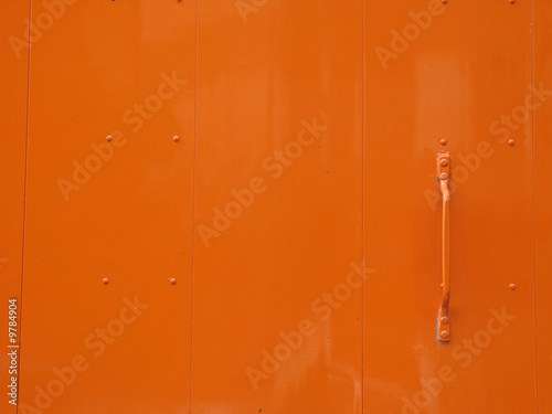 slick orange metal door