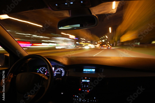 night drive with car in motion through the city shows the speed