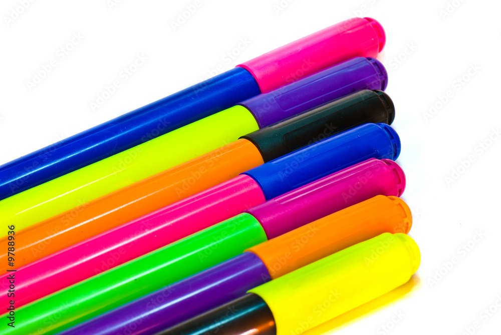 varicoloured markers on the white isolated background