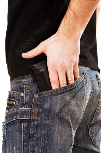 Man’s hand holding wallet in a pocket