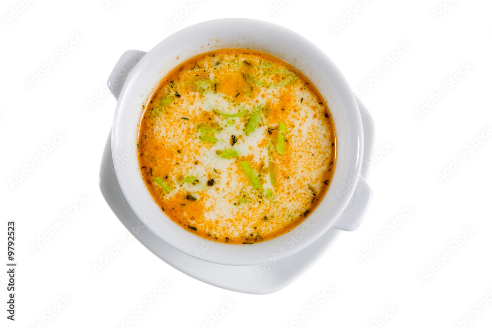 soup with green spice in white bowl