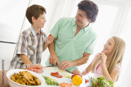 Father And Children Prepare A meal,mealtime Together