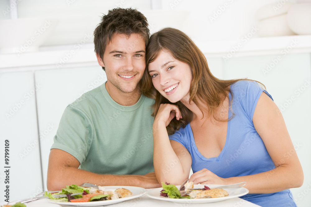 Young Couple Enjoying meal,mealtime Together Young Couple Enjoying meal,mealtime Together
