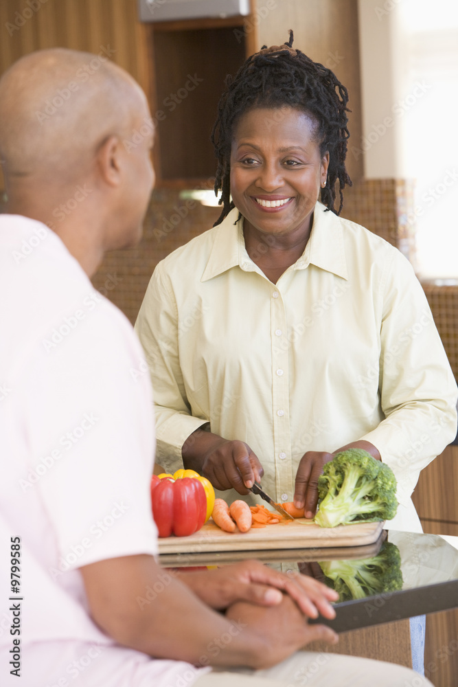 Husband And Wife Preparing A meal,mealtime Together Husband And Wife Preparing A meal,mealtime Together
