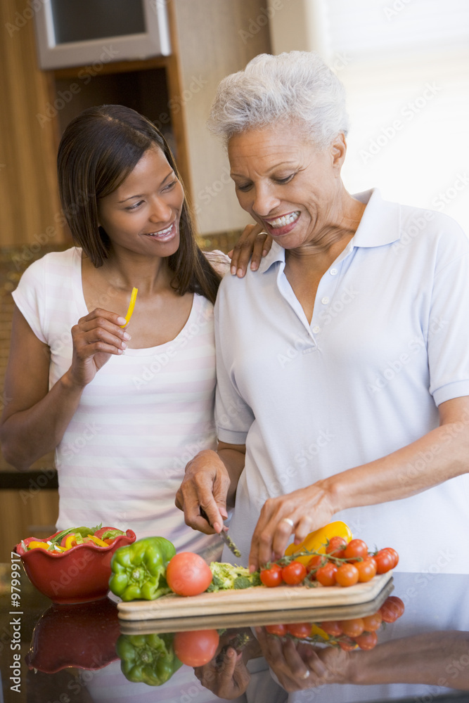 Mother And Daughter Preparing A meal,mealtime Together Mother And Daughter Preparing A meal,mealtime Together