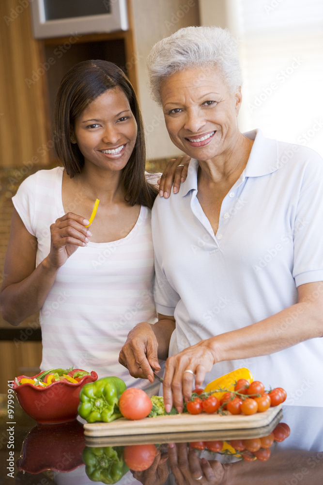 Mother And Daughter Preparing meal,mealtime Together Mother And Daughter Preparing meal,mealtime Together