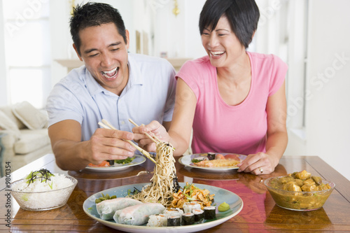 Young Couple Enjoying Chinese Food photo
