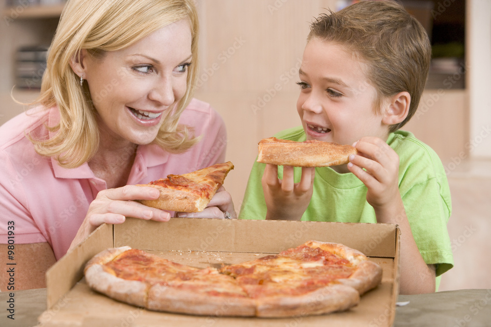 Mother And Son Eating Pizza Together Mother And Son Eating Pizza Together