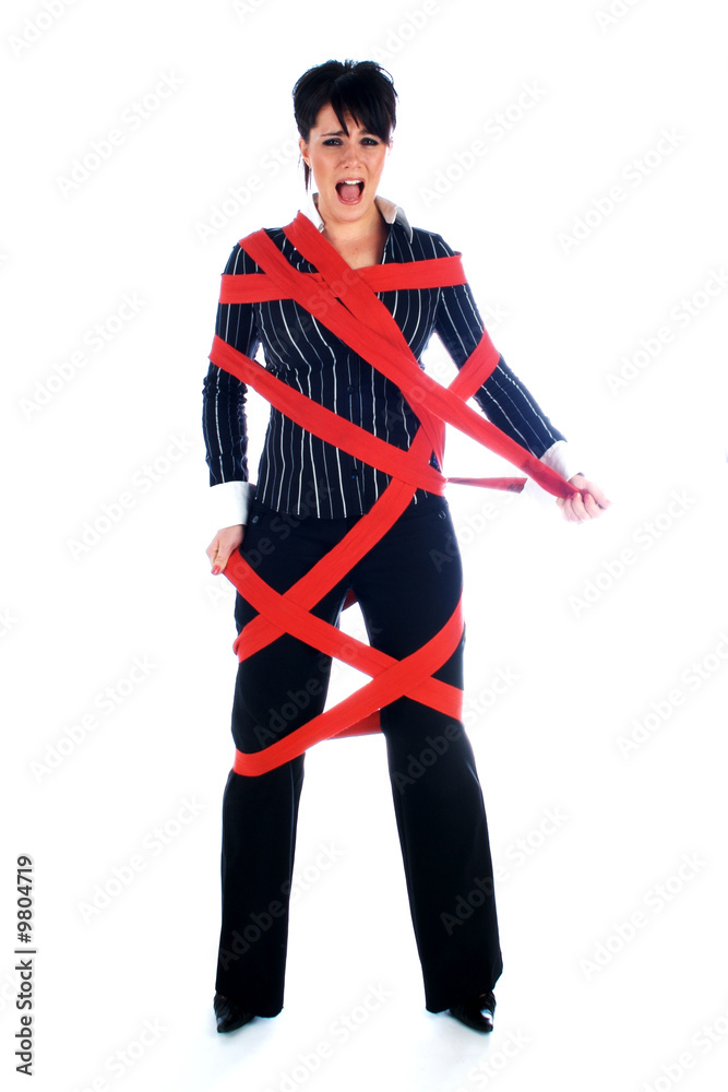 Businesswoman tied up in red tape Businesswoman tied up in red tape