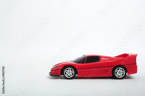 A red toy car on white background