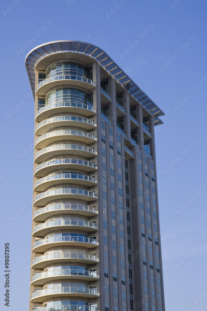 A high rise condo complex with curving balconies