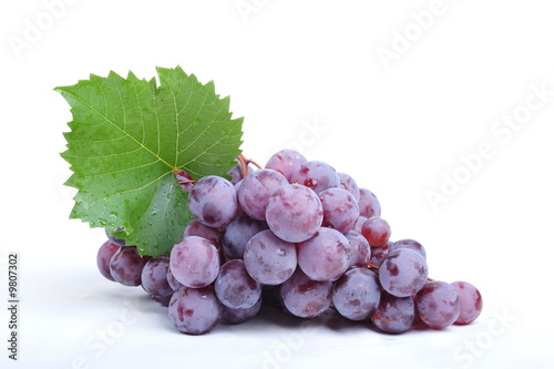 Cluster of grapes on white ...