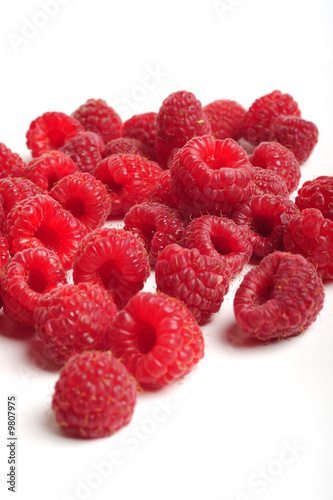 Red raspberry on white background, close up