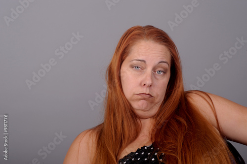 Disturbing Image of a very depressed woman on grey
