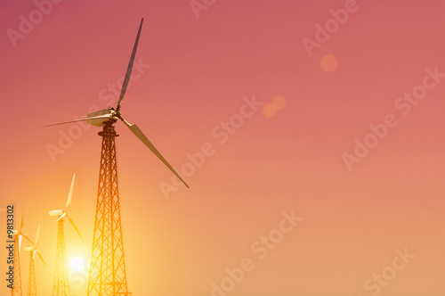 turbine on pink evening sky background © Ivan Kmit