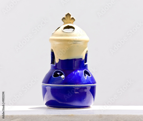 Фотография Traditional cresset standing on top of a veranda wall