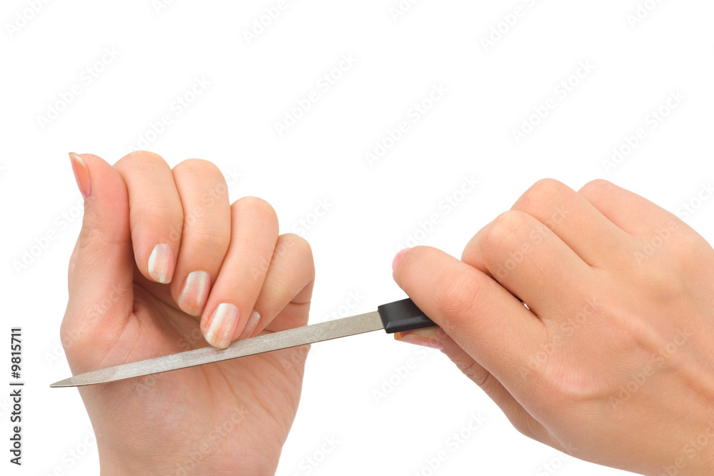 Woman hands and manicure nail file isolated on white background Woman hands and manicure nail file isolated on white background