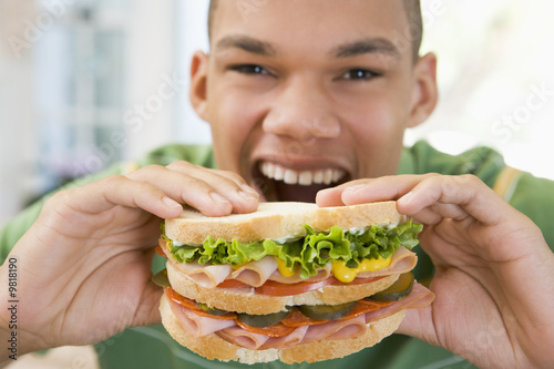Teenage Boy Eating Sandwich