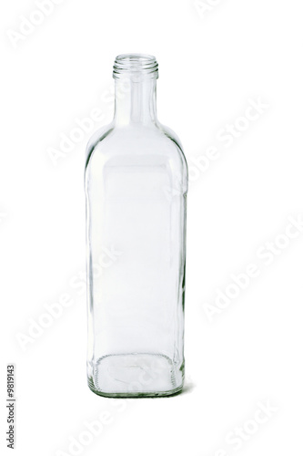 Tall empty glass bottle on white background