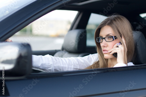 Image of busy woman calling on cellular phone © pressmaster