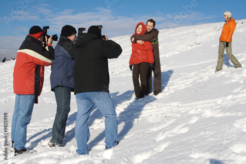 People photographing at sunny day at winter