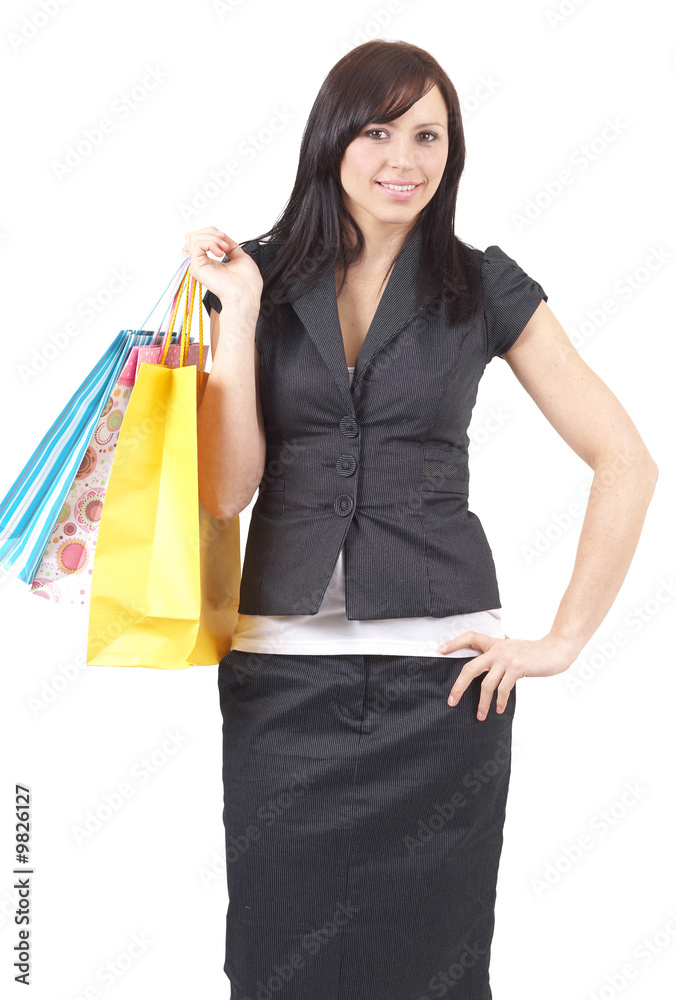 Portrait of a beautiful young brunette woman holding bags Portrait of a beautiful young brunette woman holding bags