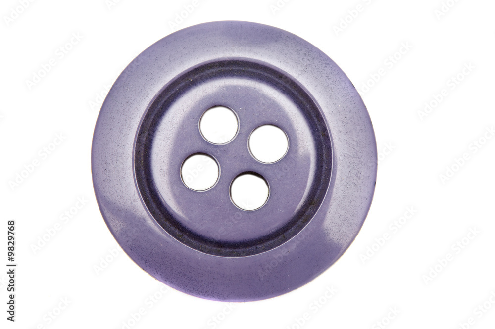 Nice button with four holes on a white background Nice button with four holes on a white background