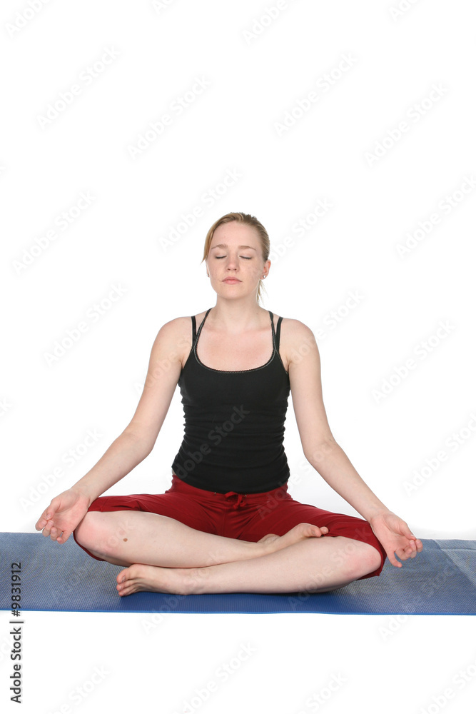 young woman demonstrating yoga lotus pose