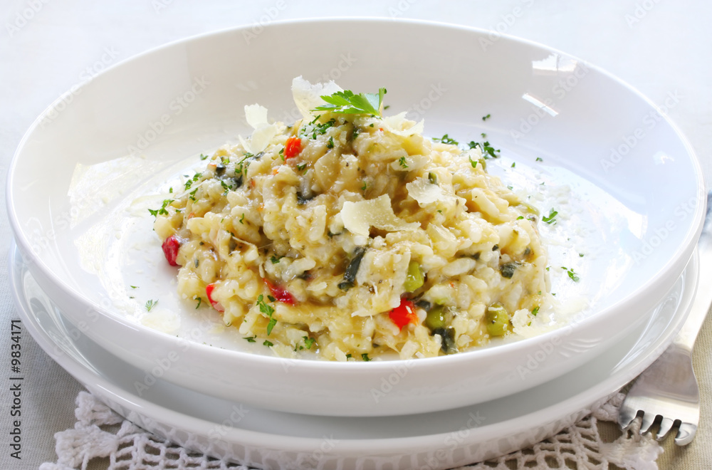Chicken and garlic risotto, garnished with shaved parmesan Chicken and garlic risotto, garnished with shaved parmesan