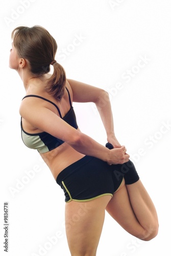 Isolated attractive fitness woman is making stretching