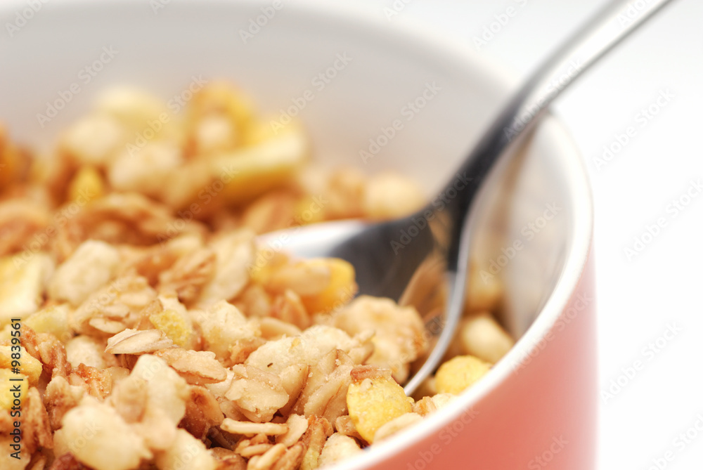 Bowl of muesli. White background, selective focus. Bowl of muesli. White background, selective focus.