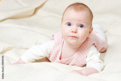 Portrait of attentive four month baby girl