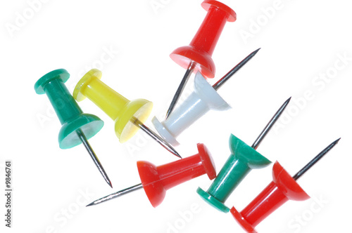Multicolored drawing pins isolated on white background
