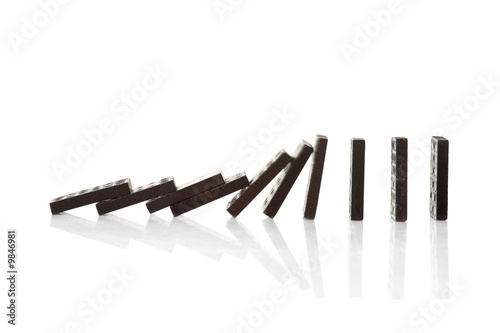 Obraz na plátně Chain reaction of domino blocks falling down