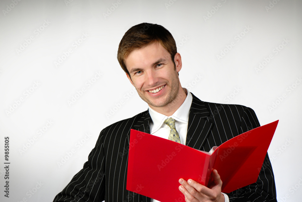 businessman looks folder of red color with documents businessman looks folder of red color with documents