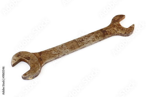 Old rusty spanner isolated on white background
