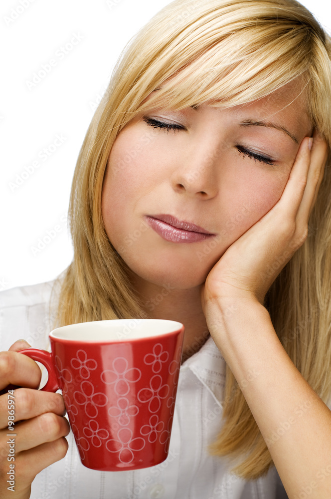 young blond woman with cup of coffee early in the morning young blond woman with cup of coffee early in the morning