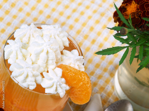 close up of jelly with tangerines in the glass bowl