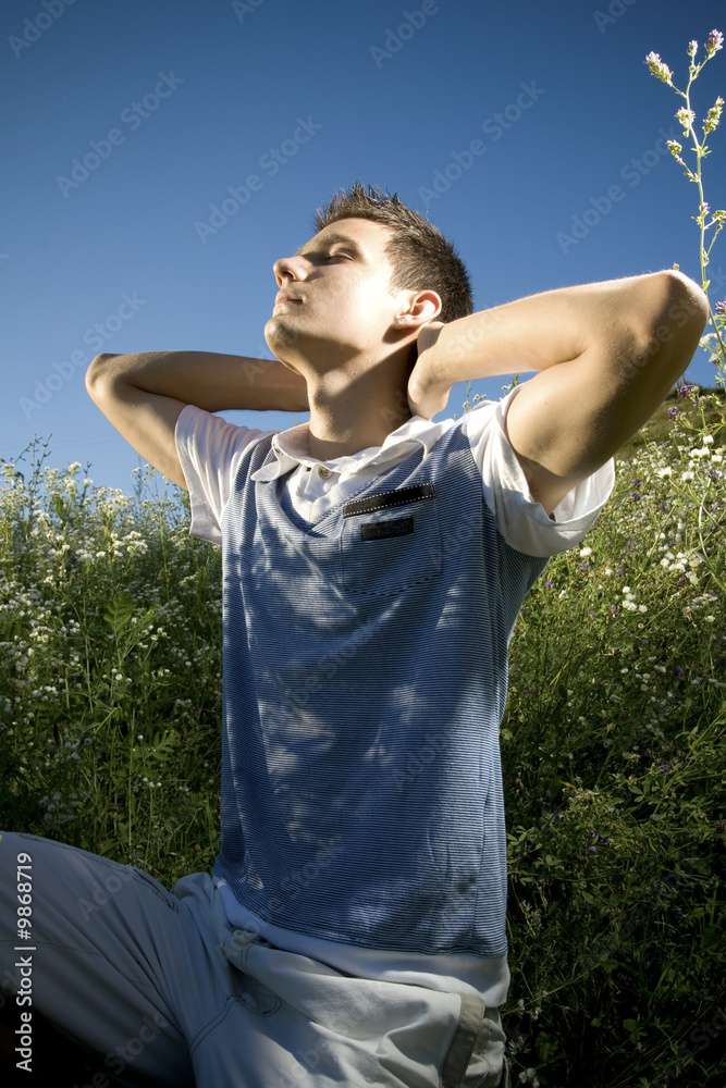 Young man stretching his body. Young man stretching his body.