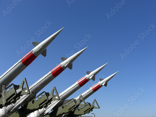 Fotografiet Four missiles against clear blue sky