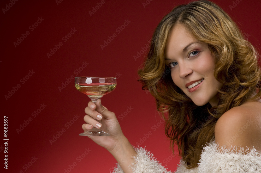 Beautiful lady toasting with champagne on red background Beautiful lady toasting with champagne on red background