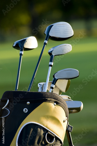 A set up new golf clubs on a beautiful golf course