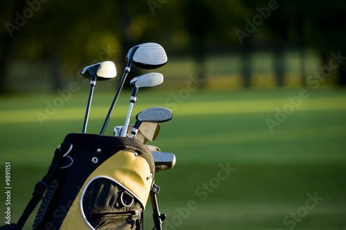 A set up new golf clubs on a beautiful golf course