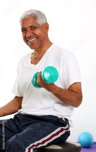 Senior Minority Man Working...